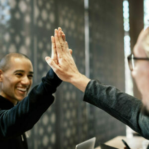 Colleagues giving a high five Colleagues giving a high five